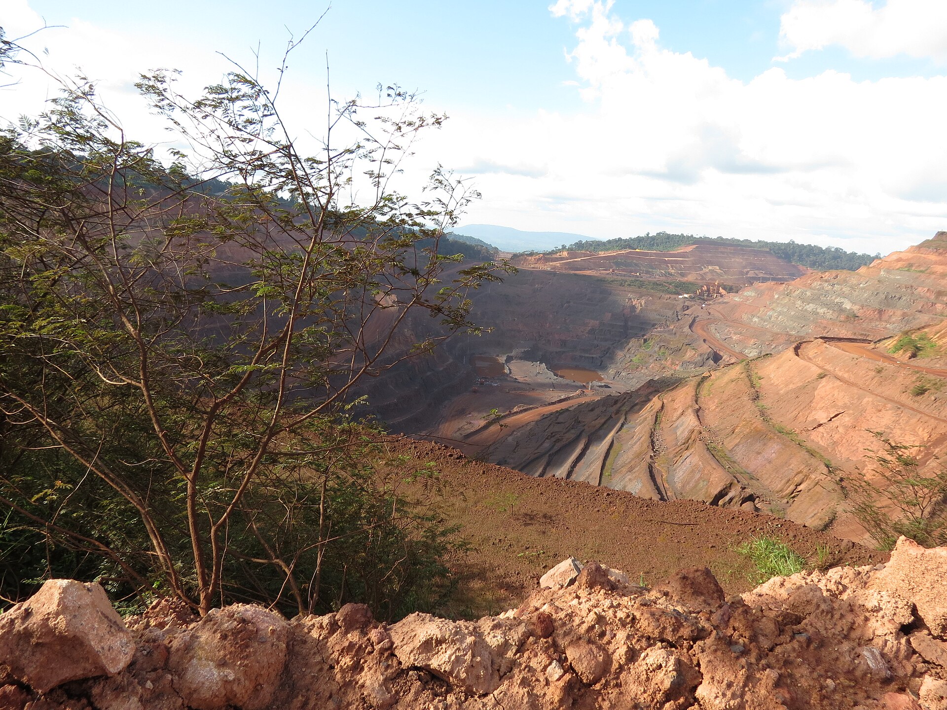 Terraced pit walls of an open-pit iron ore mine in Carajás, Pará state, Brazil