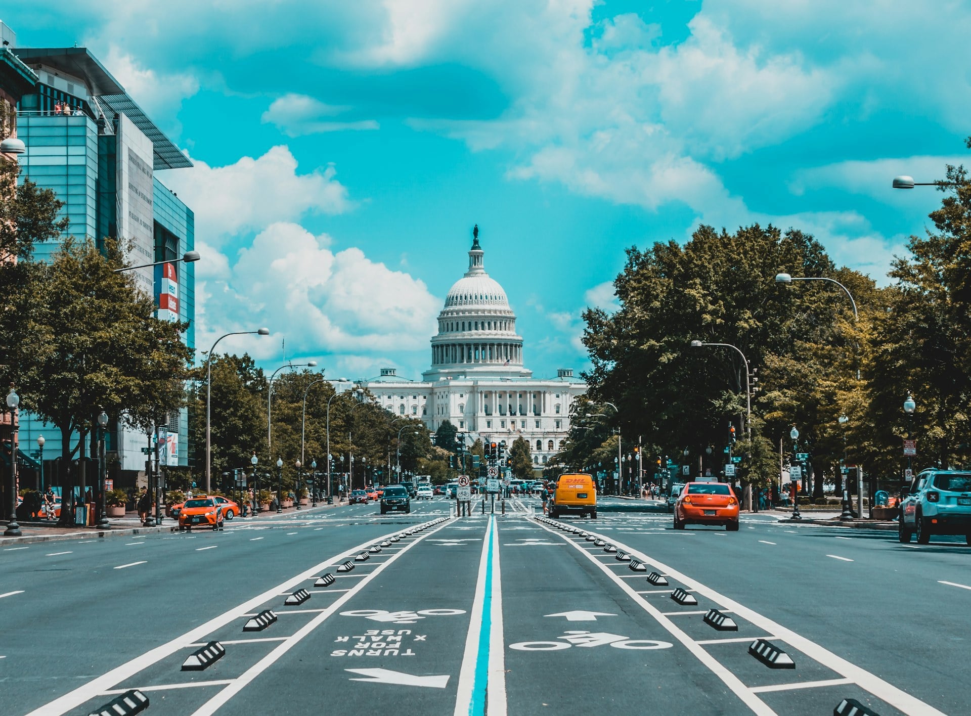 The US Capitol dome seen down Pennsylvania Avenue in Washington, DC, with cars and a bicycle lane