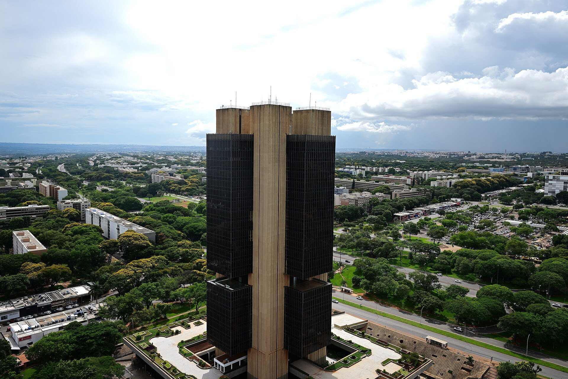 The Central Bank of Brazil headquarters tower in Brasília seen from above with the city and green avenues around it