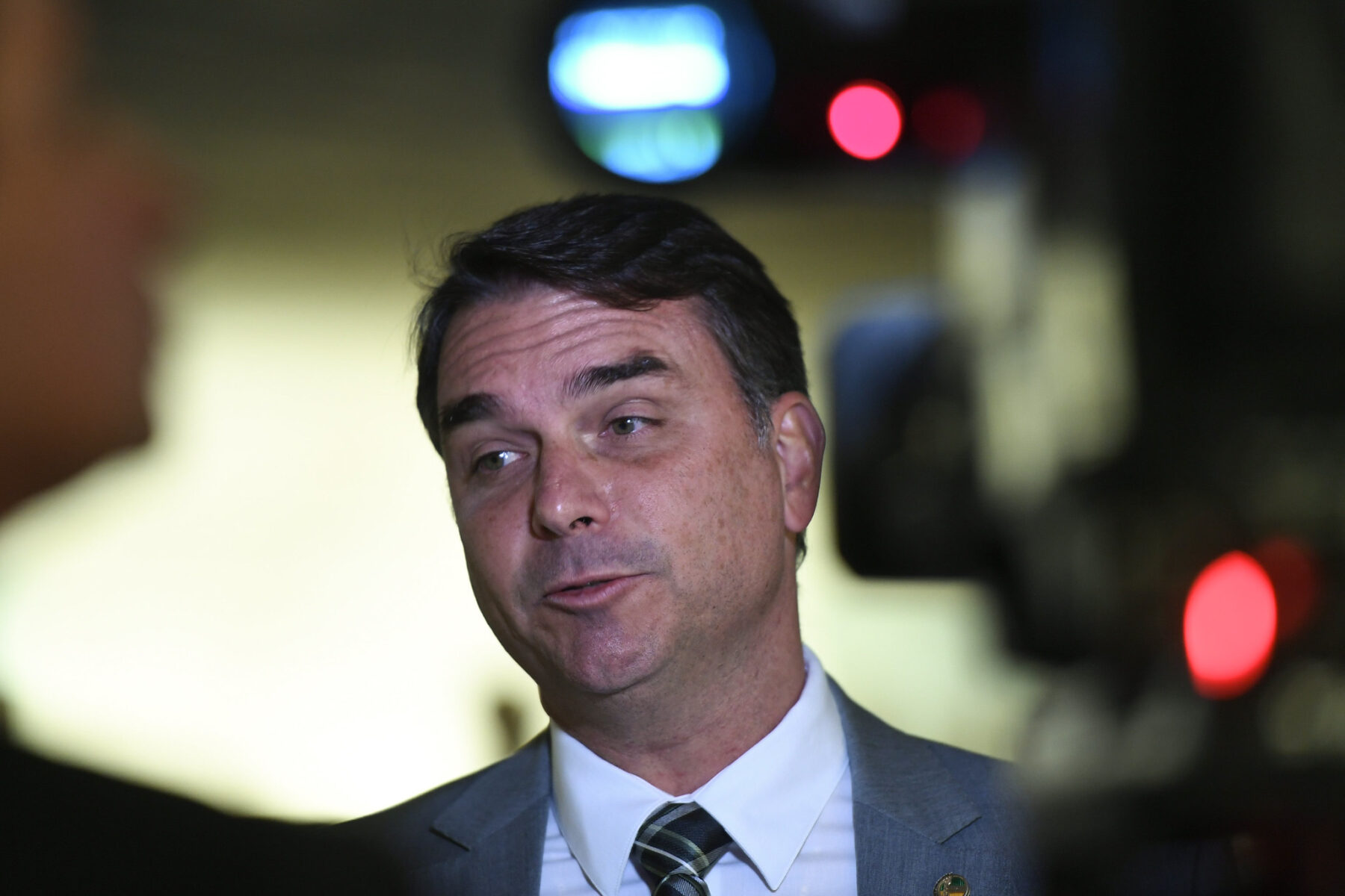 Senator Flávio Bolsonaro speaking to reporters at the Brazilian Senate
