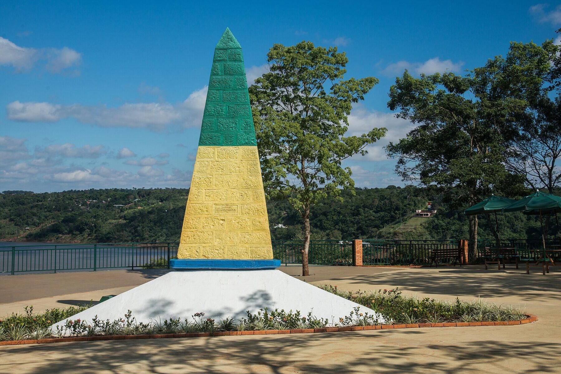 Border marker painted in the green and yellow of Brazil at the Triple Border viewpoint in Foz do Iguaçu