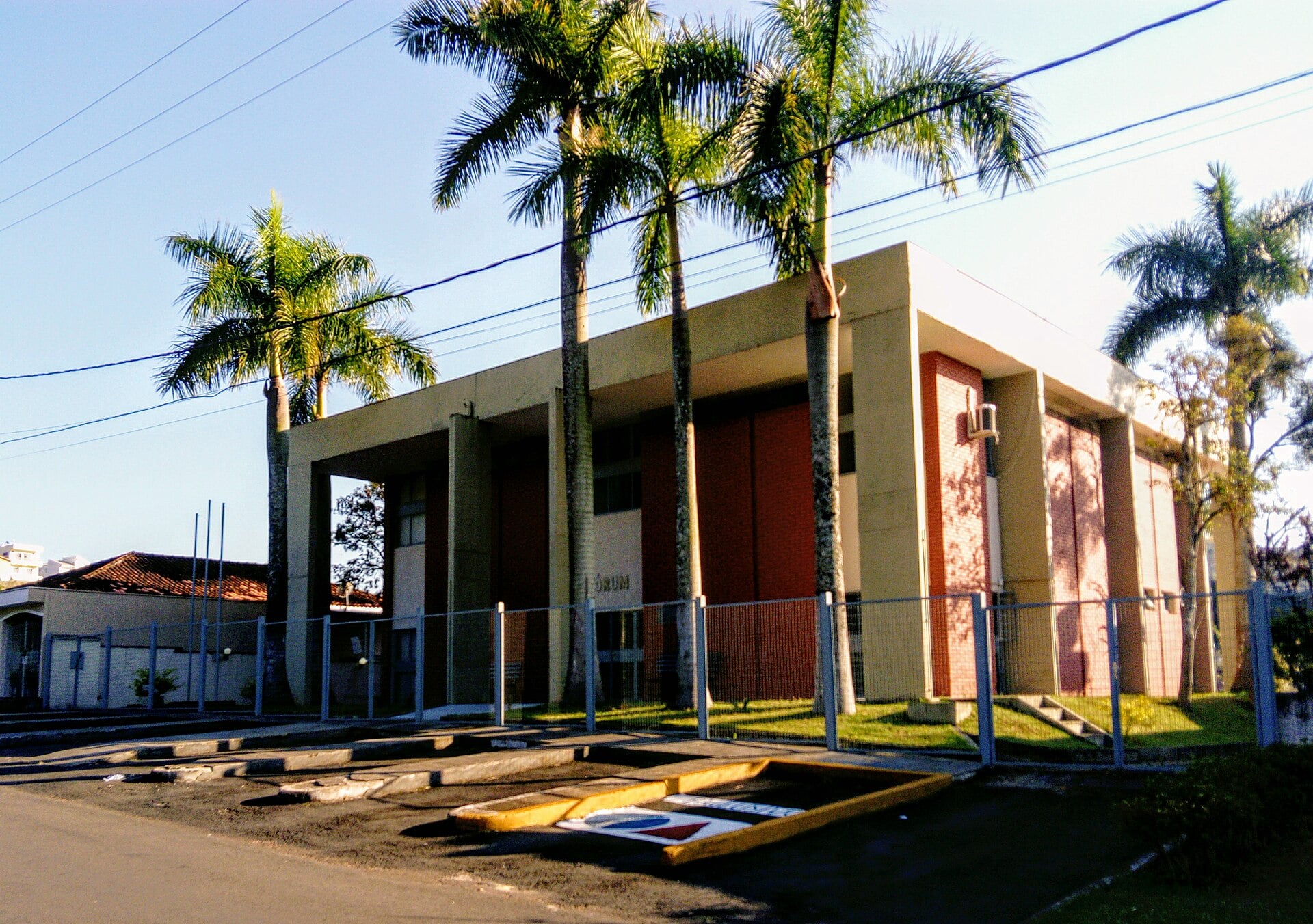 The Fórum court building of the Cabo Verde judicial district in Minas Gerais state, Brazil, with palm trees in front