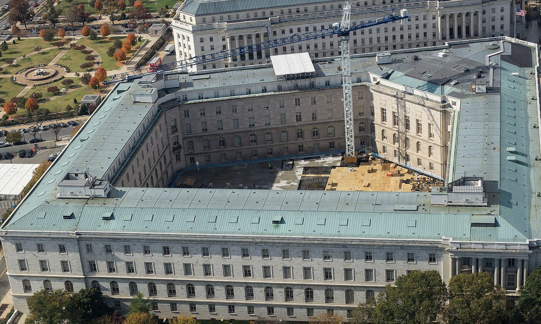 Aerial view of the Cannon House Office Building on Capitol Hill in Washington, with a construction crane in the courtyard