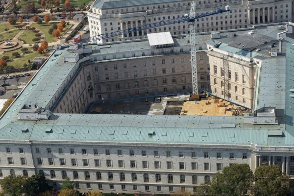 Aerial view of the Cannon House Office Building on Capitol Hill in Washington, with a construction crane in the courtyard