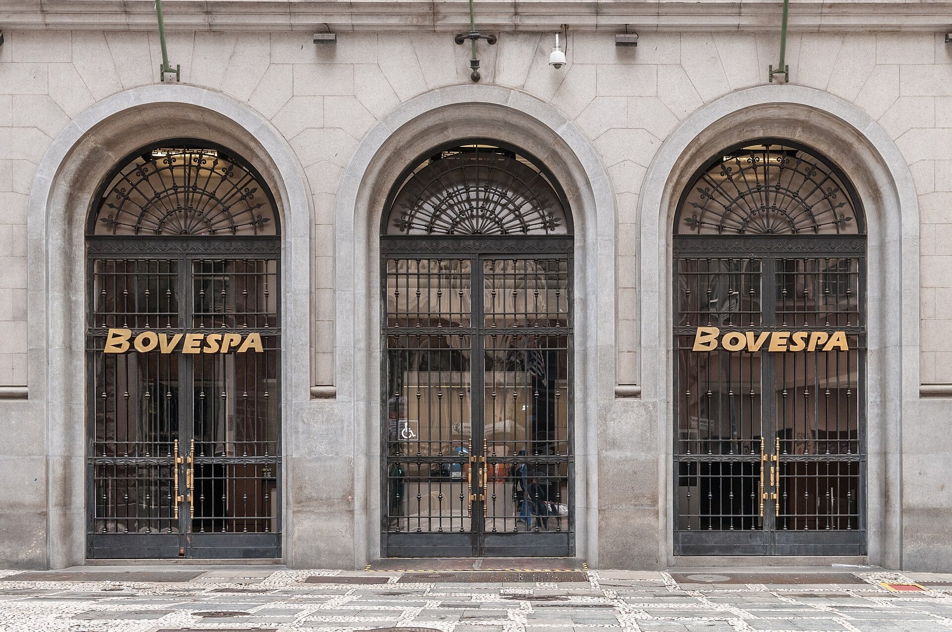 The arched entrance of the old Bovespa stock exchange building in São Paulo with the name BOVESPA over the doors