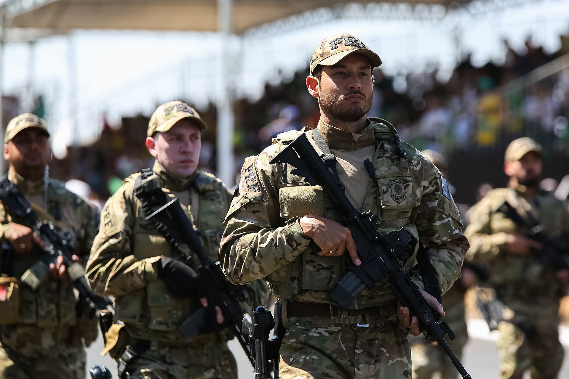 Brazilian Federal Highway Police officers in camouflage carrying rifles during a parade