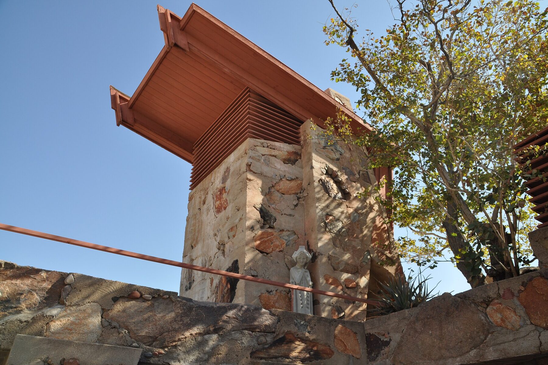 Stone pier and overhanging redwood roof beams at Taliesin West, Frank Lloyd Wright's desert home in Scottsdale, Arizona