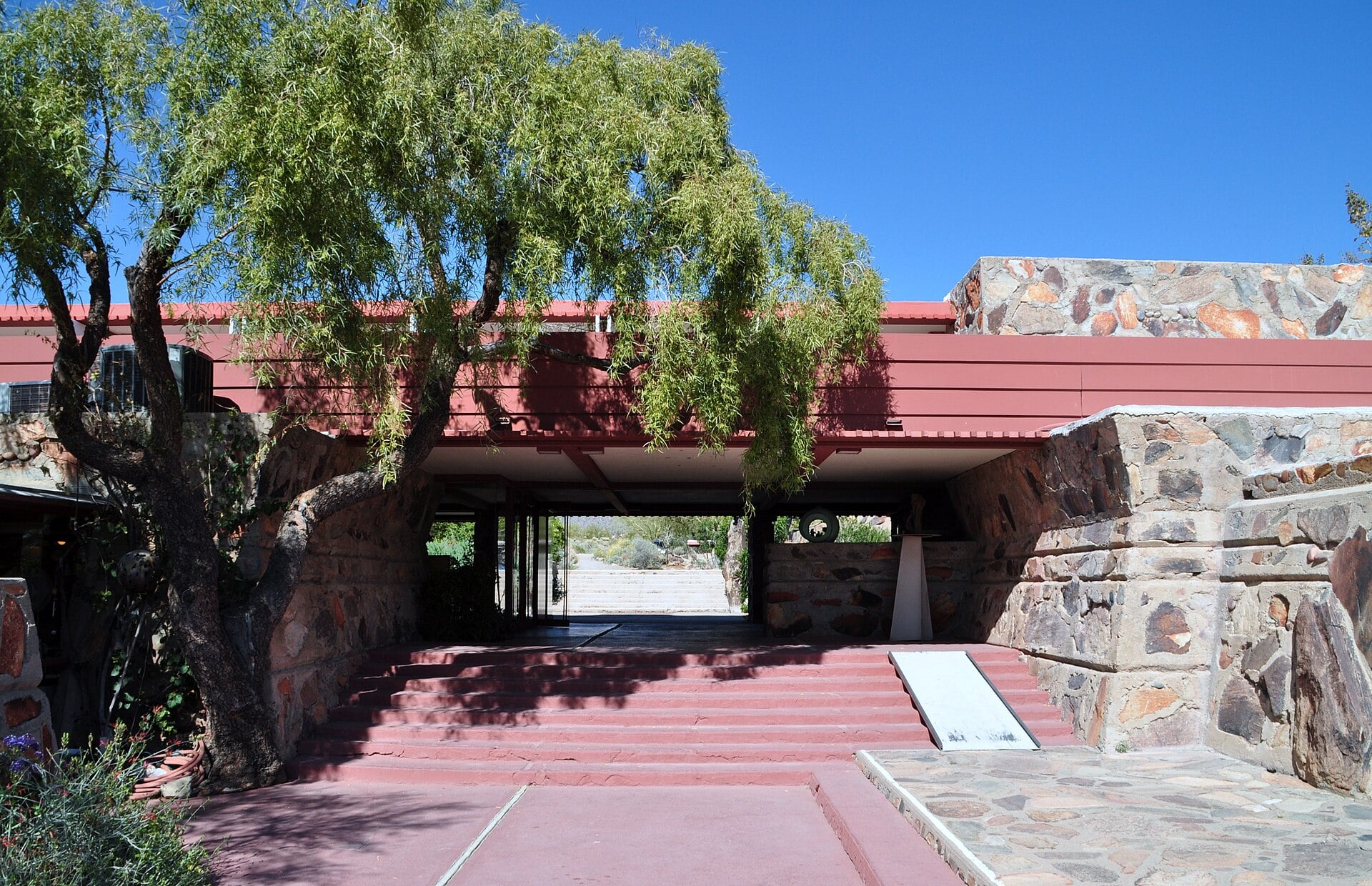 A covered stone and red-concrete passage at Taliesin West in Scottsdale, Arizona