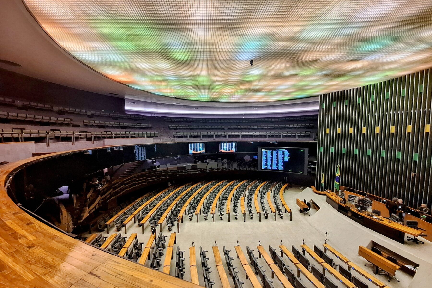 The main chamber of the Brazilian Chamber of Deputies in Brasília, seen from the gallery, with the voting panel and the green and yellow wall