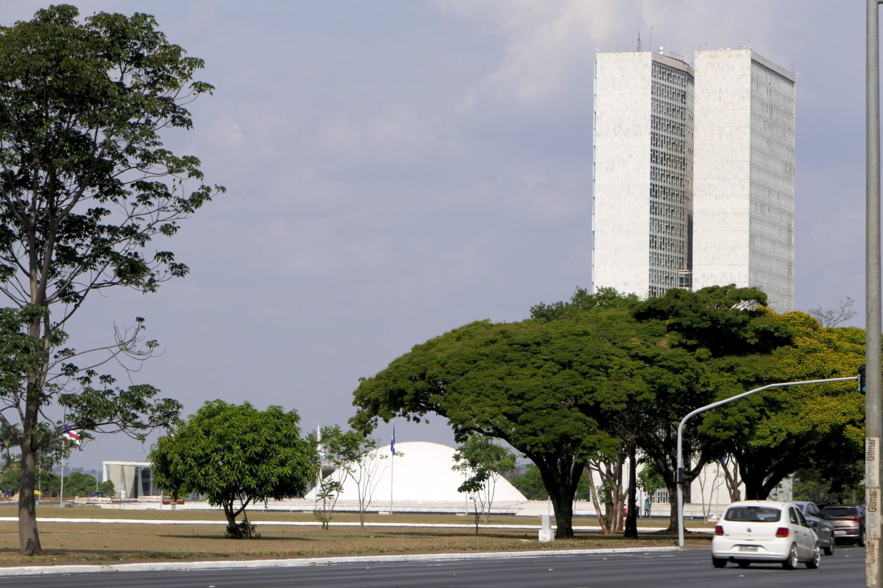 The twin towers and domes of the Congresso Nacional in Brasília seen across the Esplanada