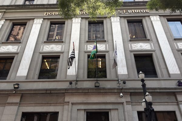 Facade of the former Bolsa de Mercadorias & Futuros building in downtown São Paulo with Brazilian, São Paulo state and B3 flags