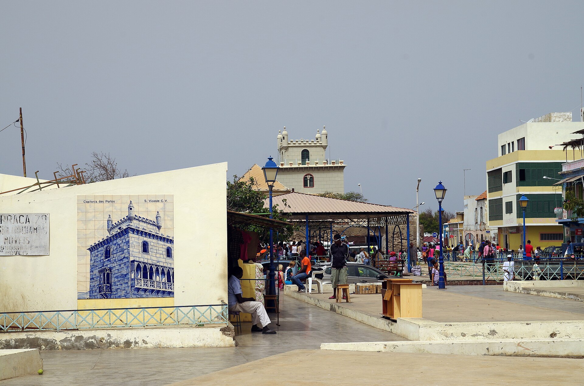 Praça Estrela market square in Mindelo, Cabo Verde, with stalls under a canopy and a tower in the background