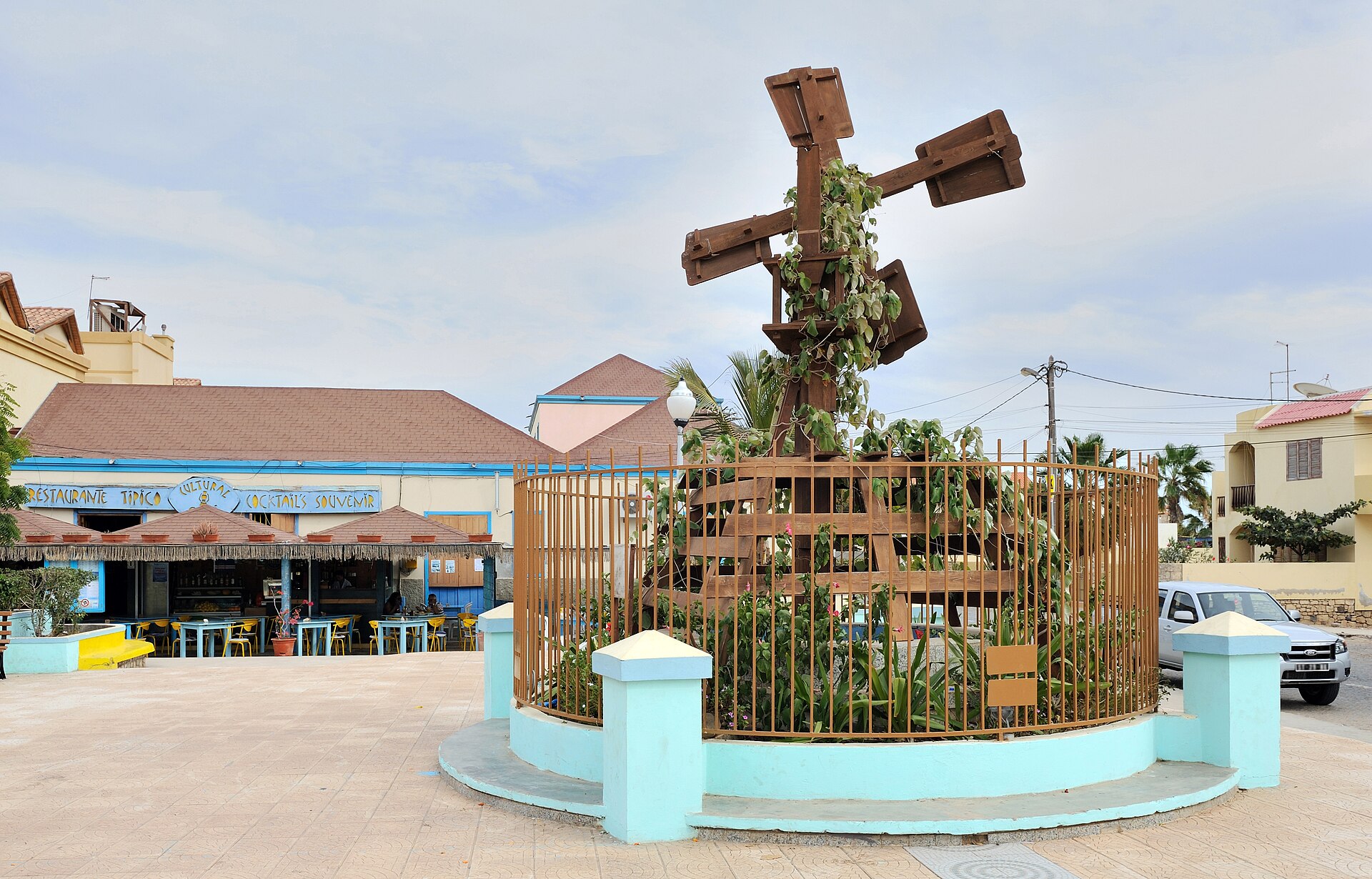 The Marcelo Leitão square in Santa Maria, Sal, with an old wooden windmill and a restaurant for tourists