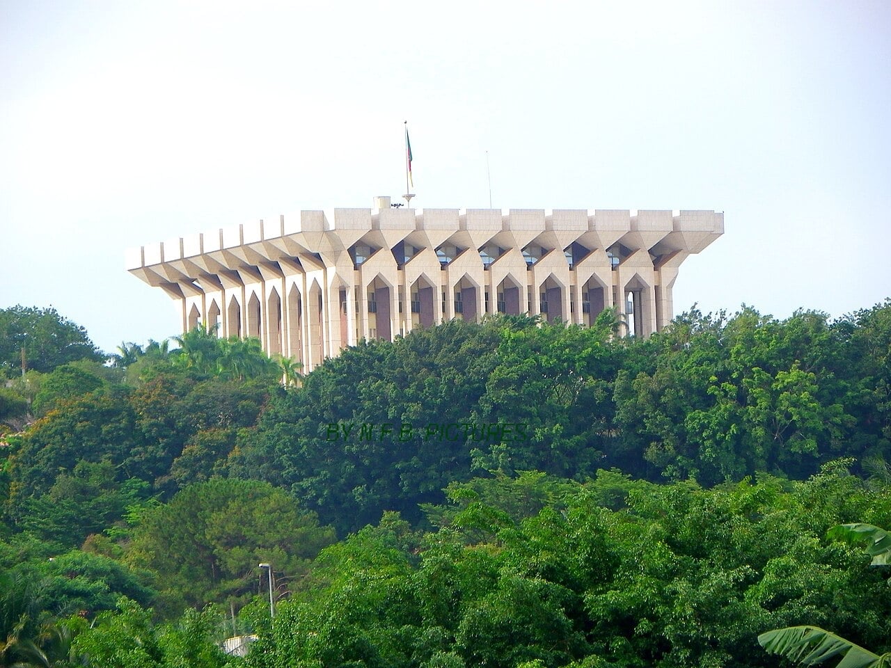 The Unity Palace in Yaoundé, the presidential palace and seat of power in Cameroon, rising above the trees
