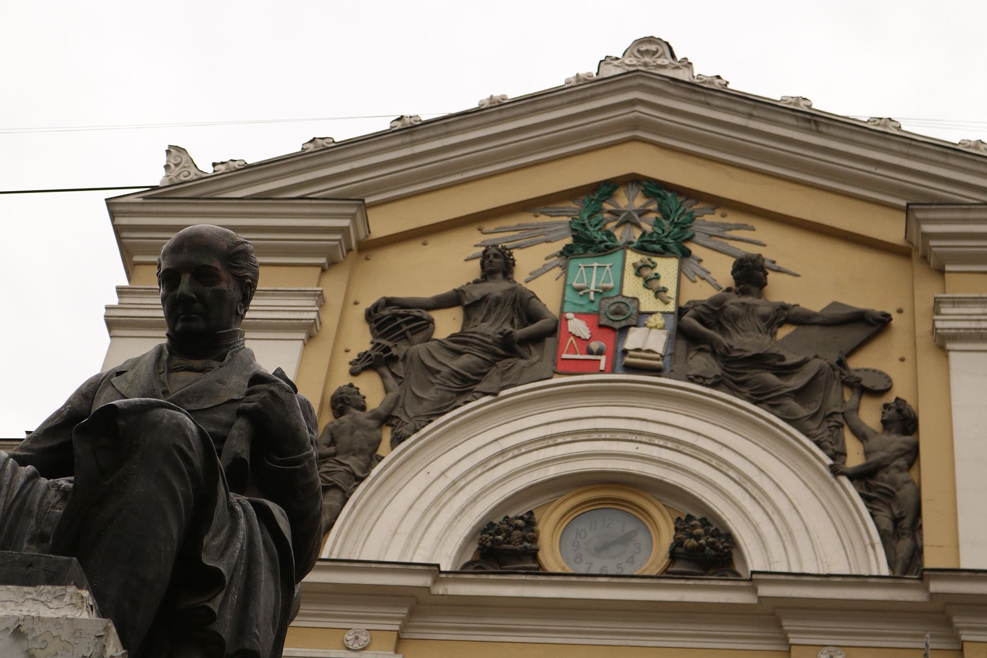 Statue of Andrés Bello in front of the pediment of the Casa Central, University of Chile