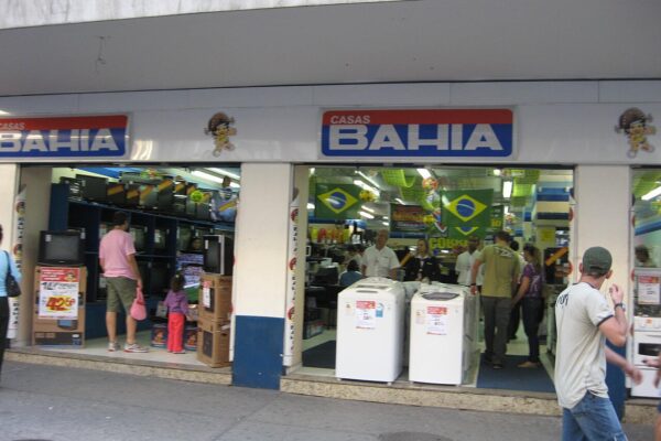 Casas Bahia store entrance with washing machines and televisions on display in Brazil