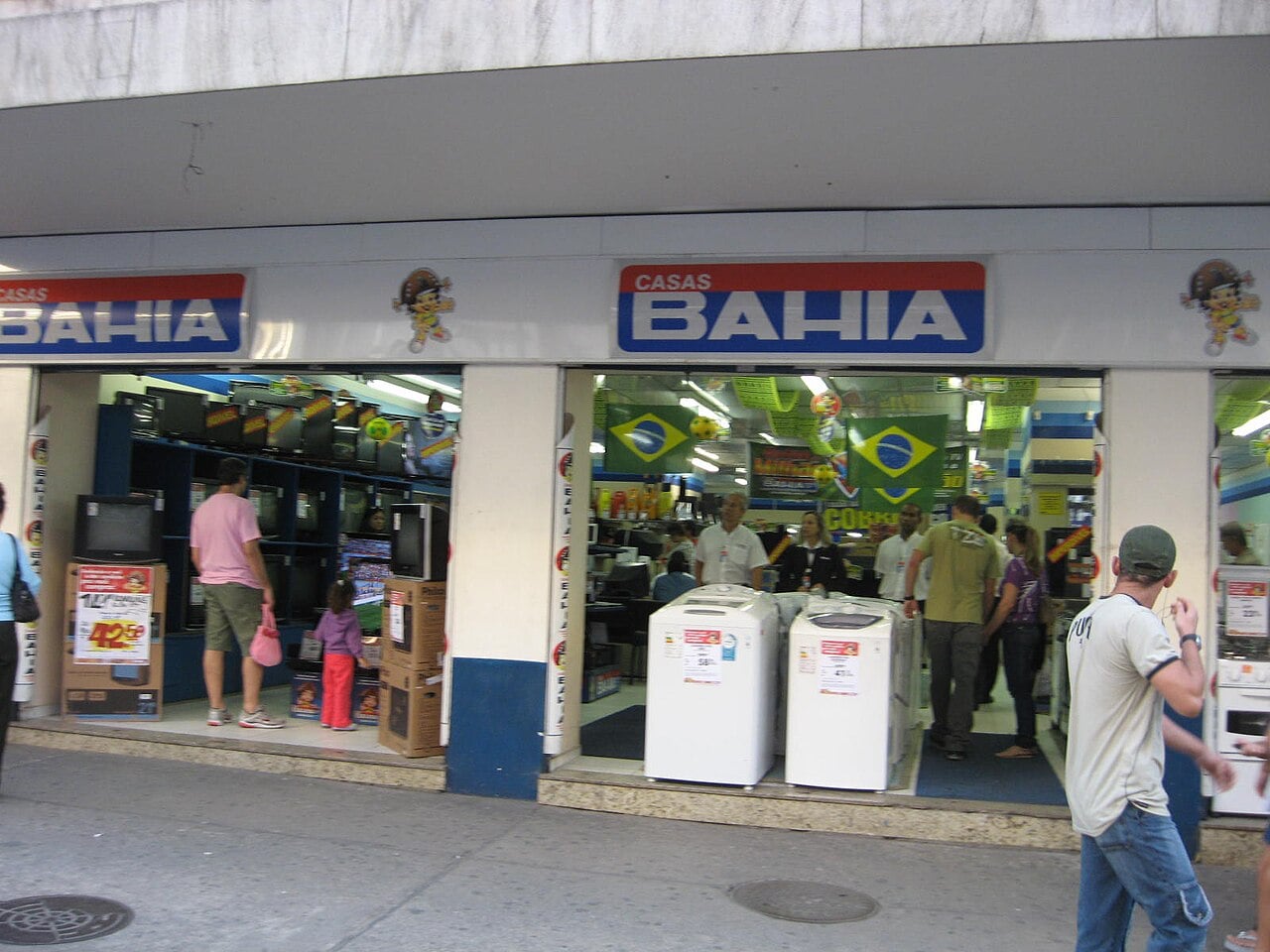 Casas Bahia store entrance with washing machines and televisions on display in Brazil