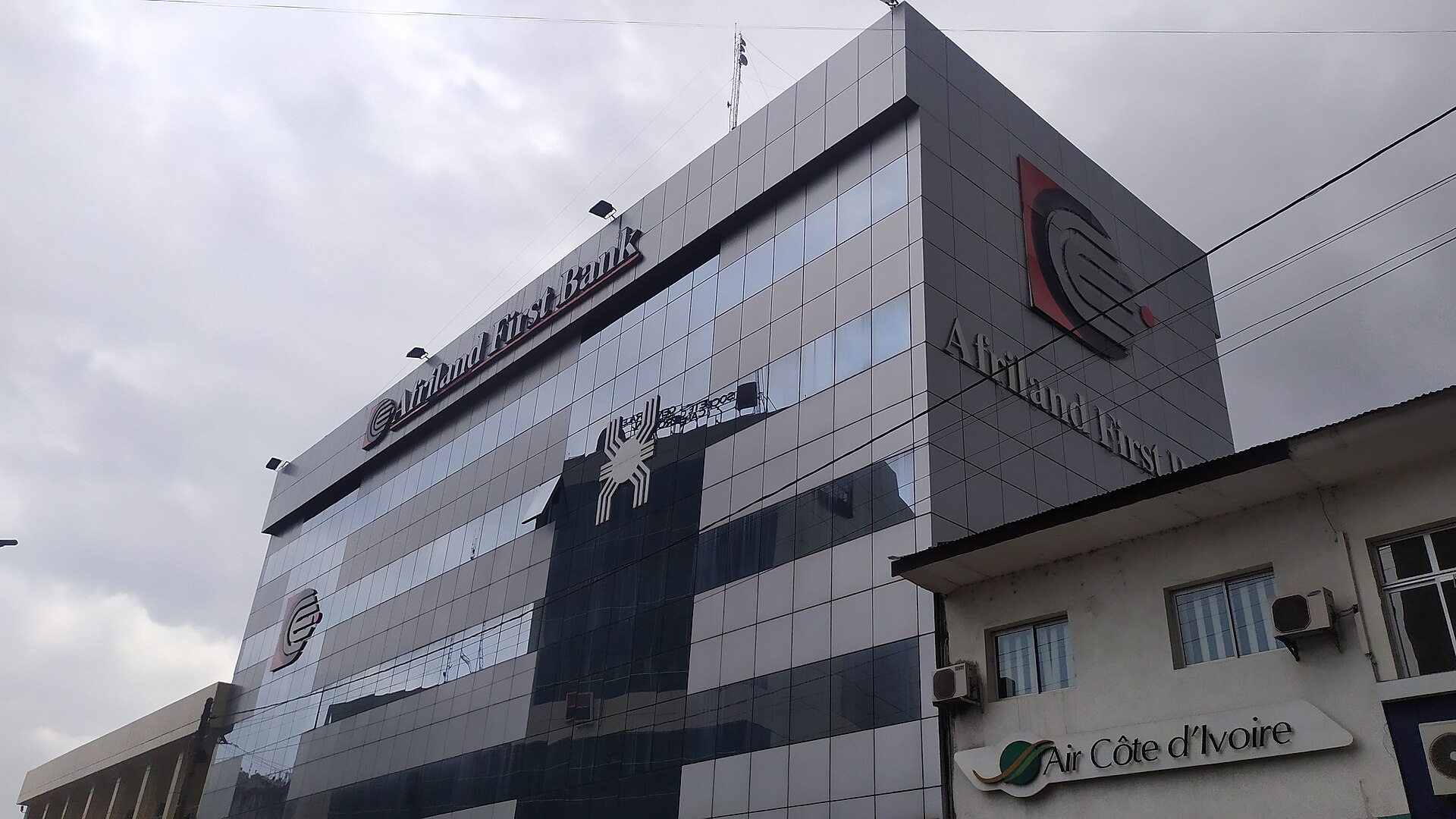 An Afriland First Bank office building in Cameroon under a grey sky