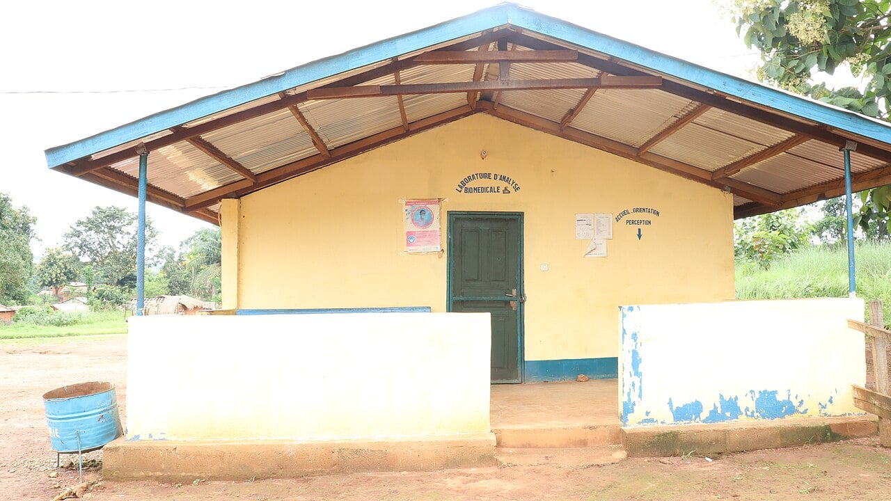 The biomedical laboratory building of a rural health centre in Boali, Central African Republic, with a blue-trimmed roof
