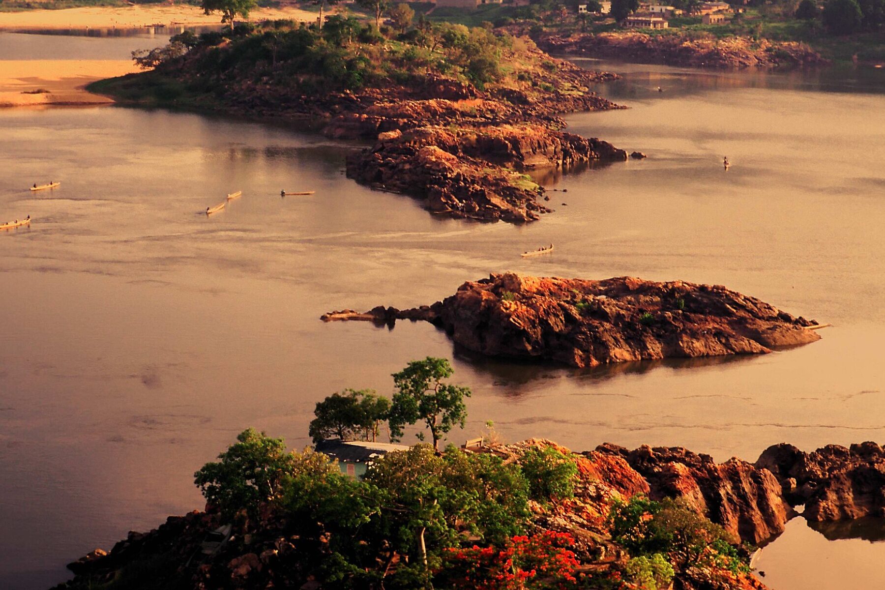 Dugout canoes and rocky islets on the Ubangi River at Bangui, Central African Republic