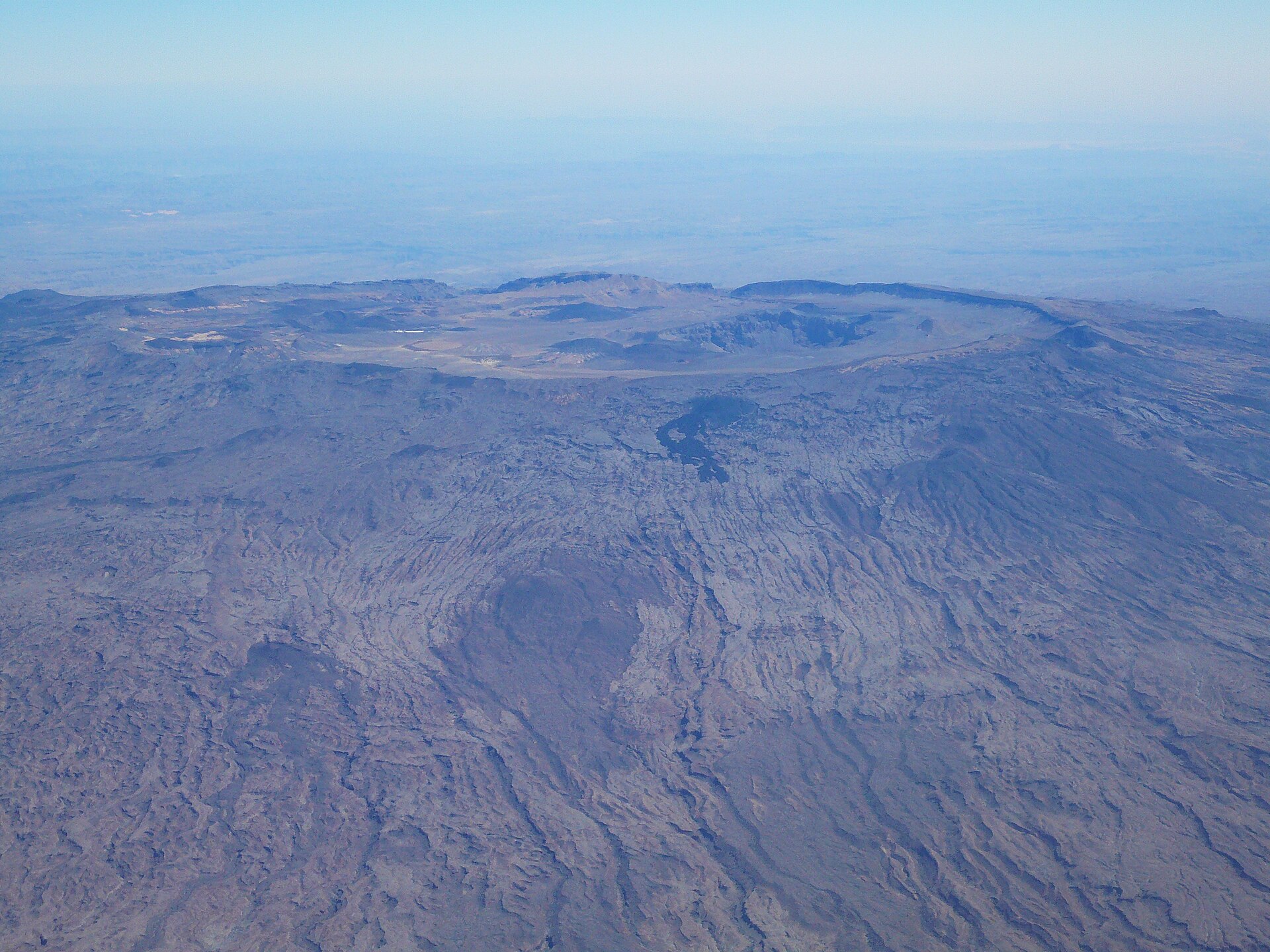 Aerial view of the wide crater of Emi Koussi volcano at the southeast end of the Tibesti mountains in Chad
