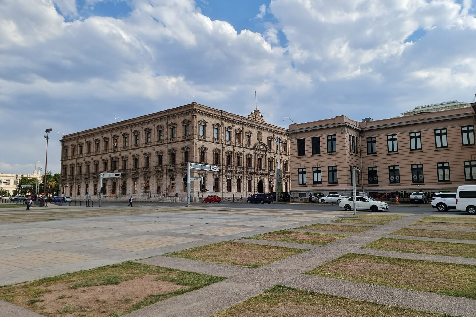 Historic government buildings on the Plaza Mayor in Chihuahua City, Mexico, under a cloudy sky