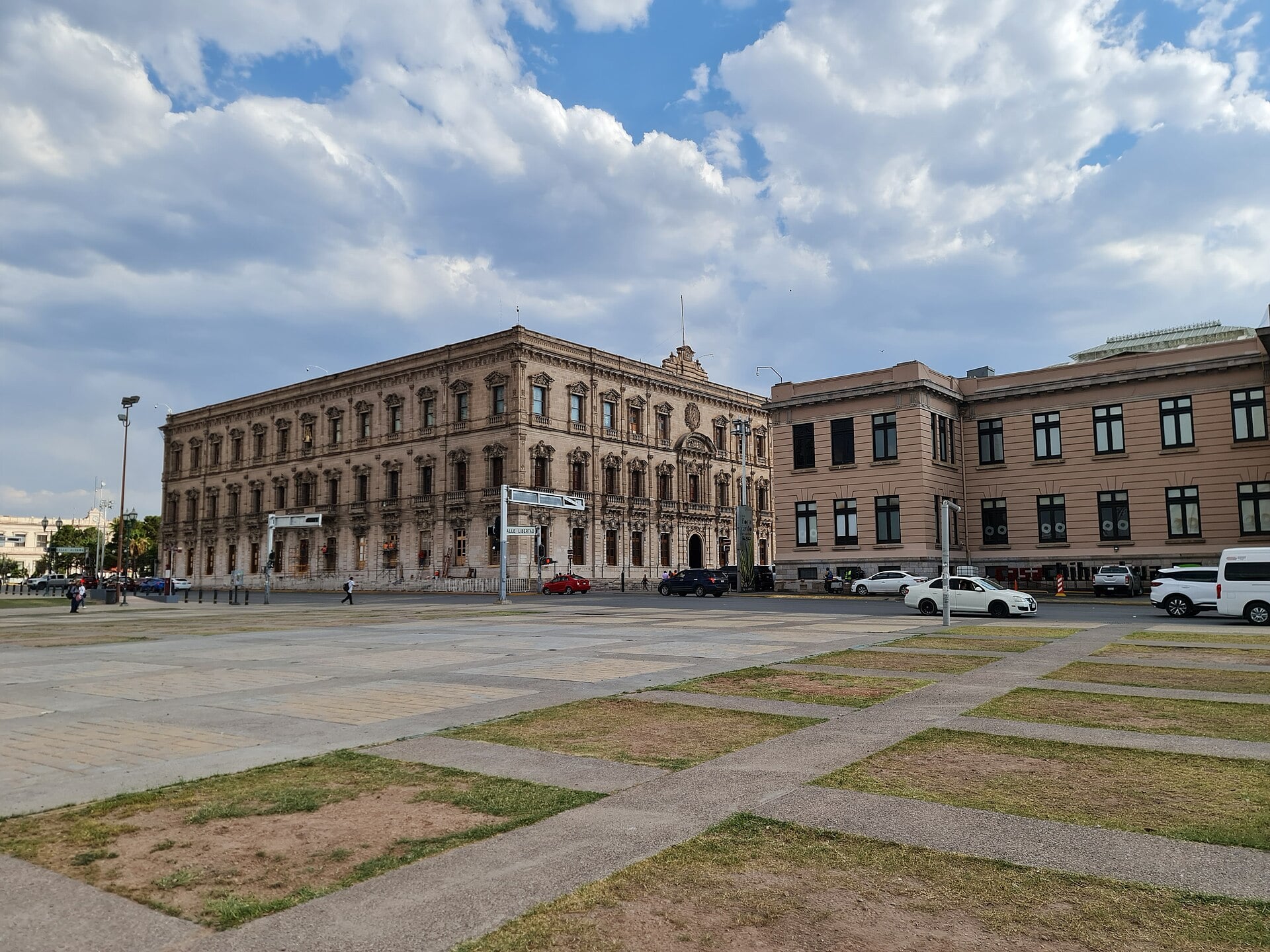 Historic government buildings on the Plaza Mayor in Chihuahua City, Mexico, under a cloudy sky
