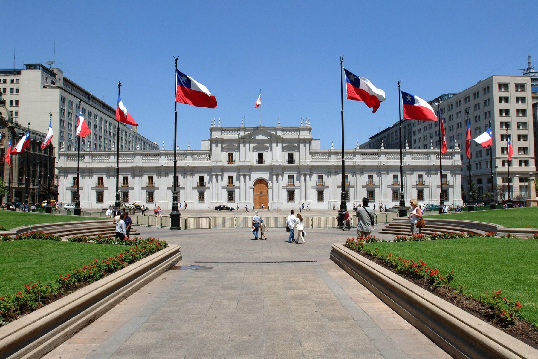 La Moneda presidential palace in Santiago, Chile, framed by Chilean flags