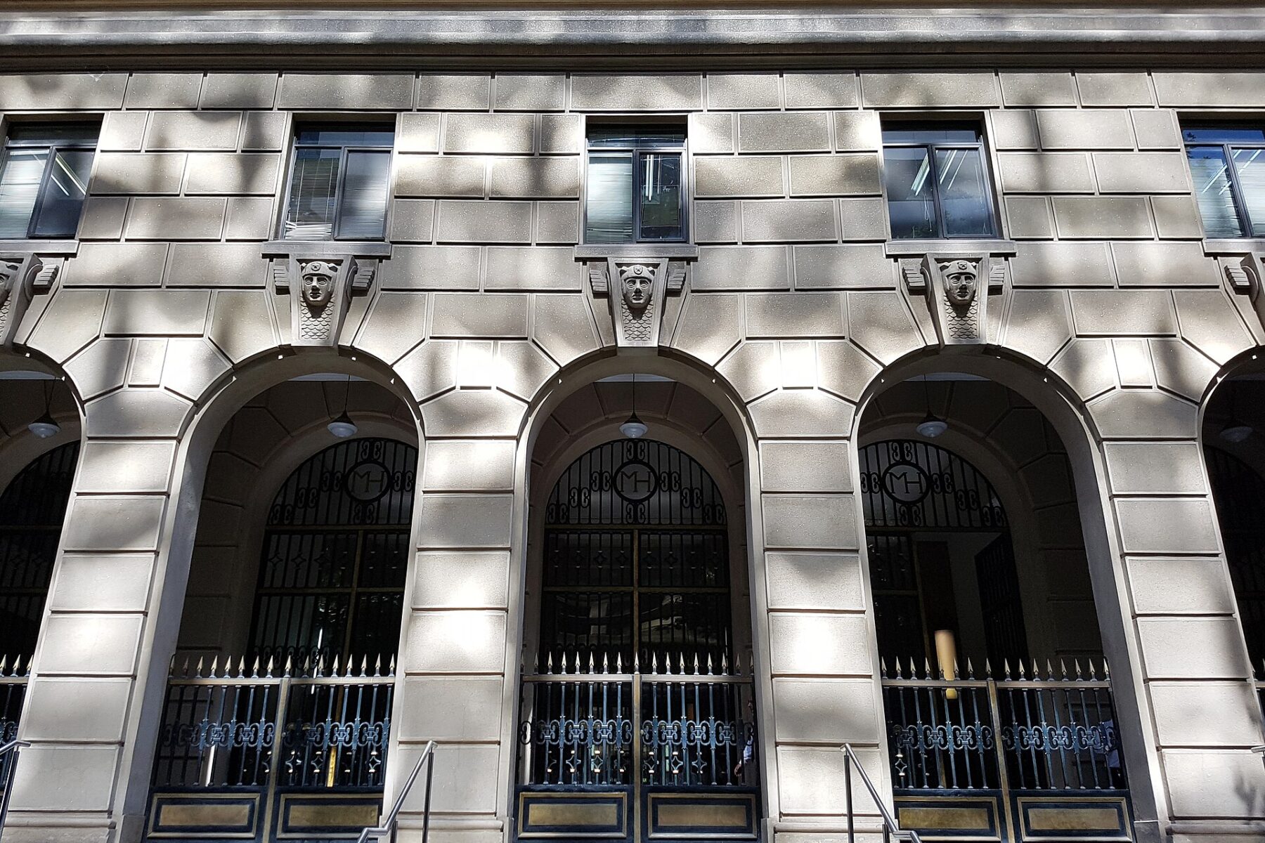 Arched entrance gates with the MH monogram at the Finance Ministry building in Santiago, Chile