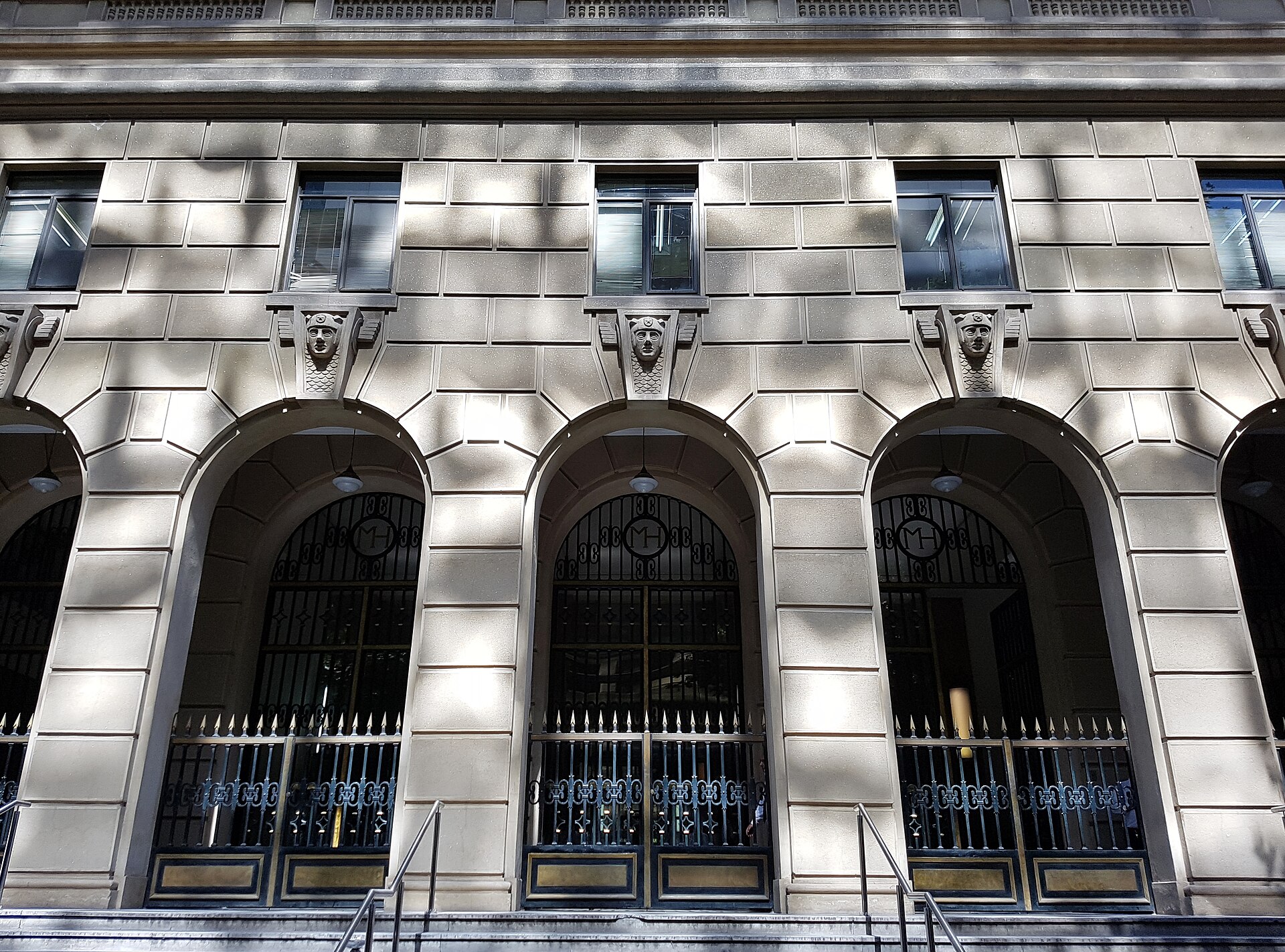 Arched entrance gates with the MH monogram at the Finance Ministry building in Santiago, Chile