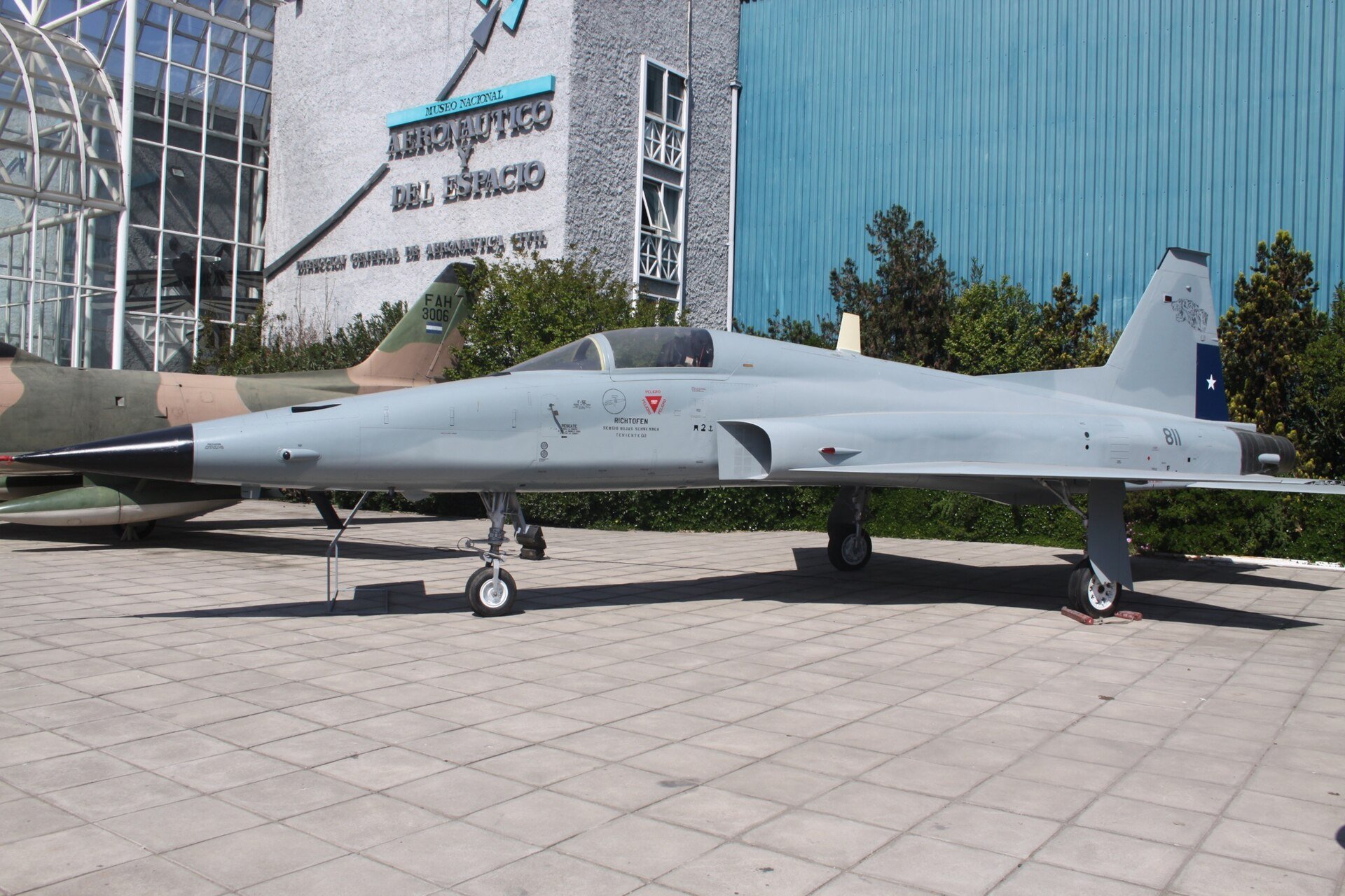 A grey Chilean Air Force Northrop F-5E fighter numbered 811 on display outside the National Aeronautical and Space Museum in Santiago