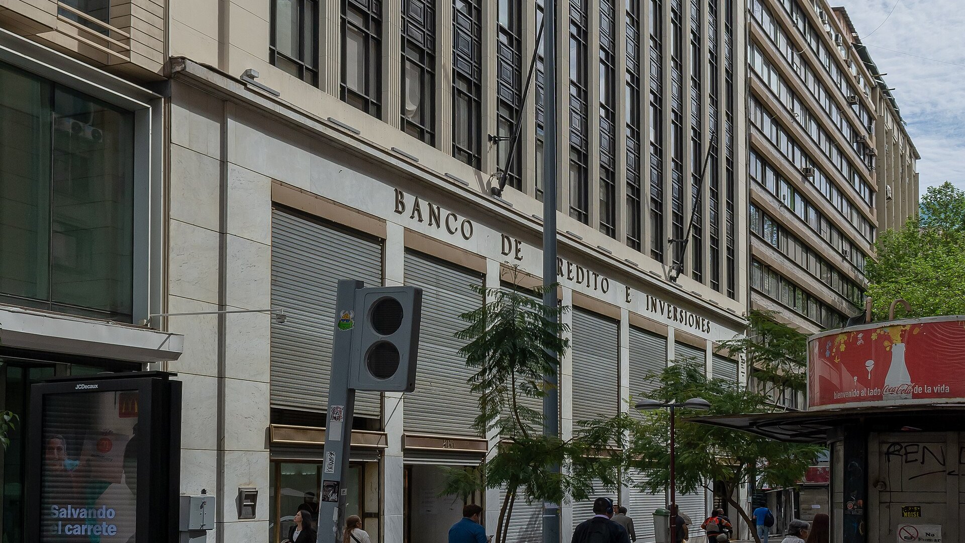 Building in downtown Santiago with the lettering Banco de Credito e Inversiones above shuttered ground-floor windows