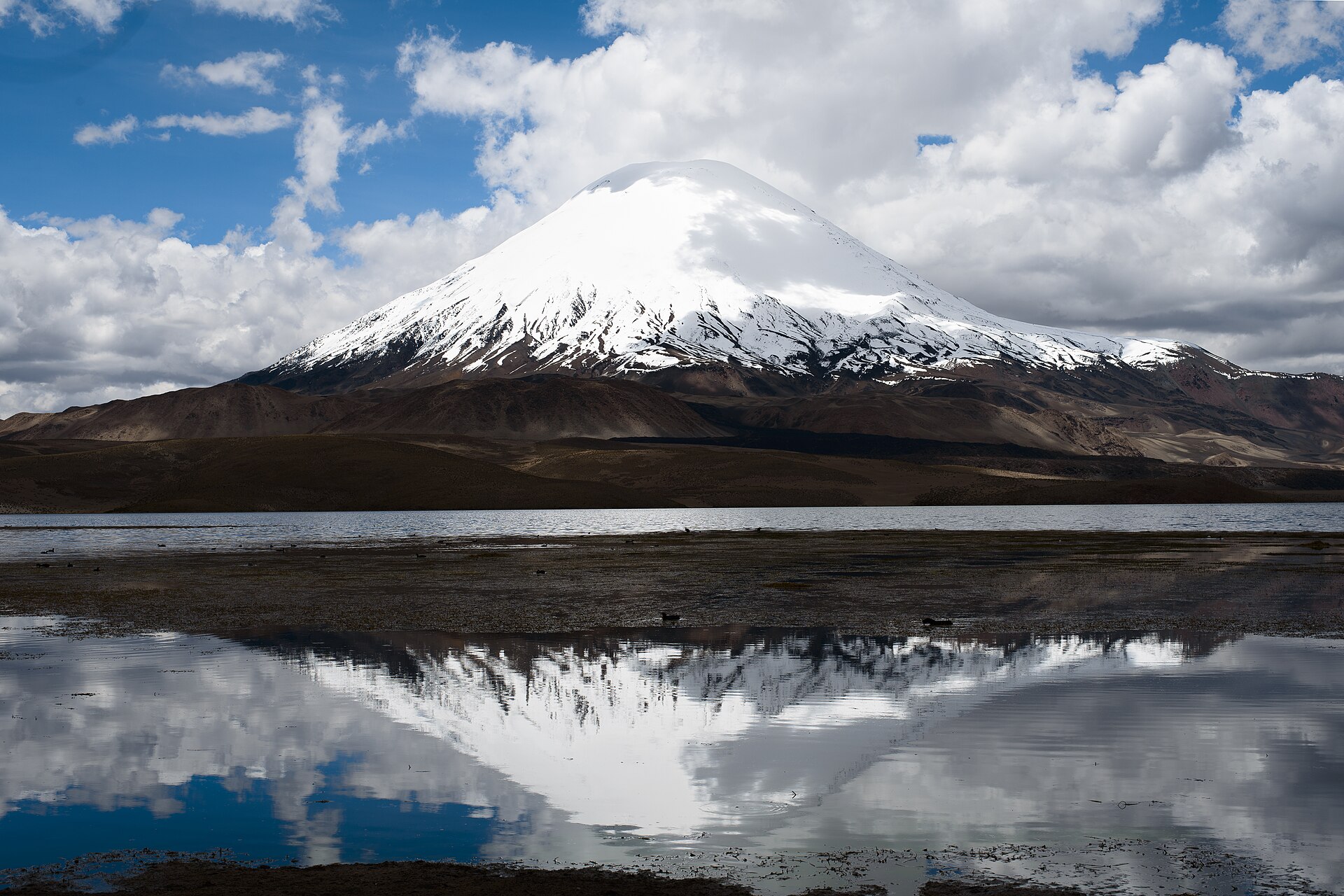 Snow-capped Parinacota volcano reflected in Lake Chungará in northern Chile