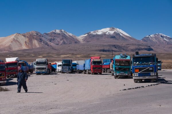 Cargo trucks parked at the Chungará–Tambo Quemado border crossing between Chile and Bolivia
