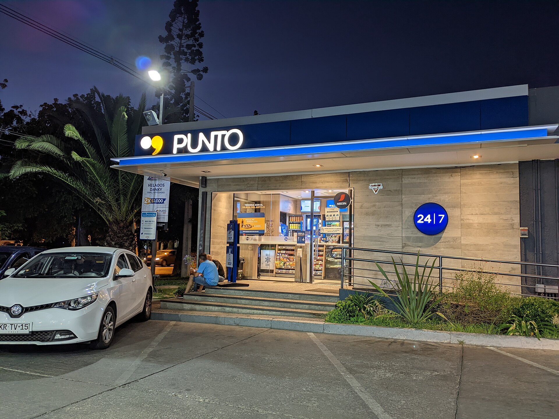 A Punto Copec convenience store at night at a Copec station in Ñuñoa, Santiago, Chile