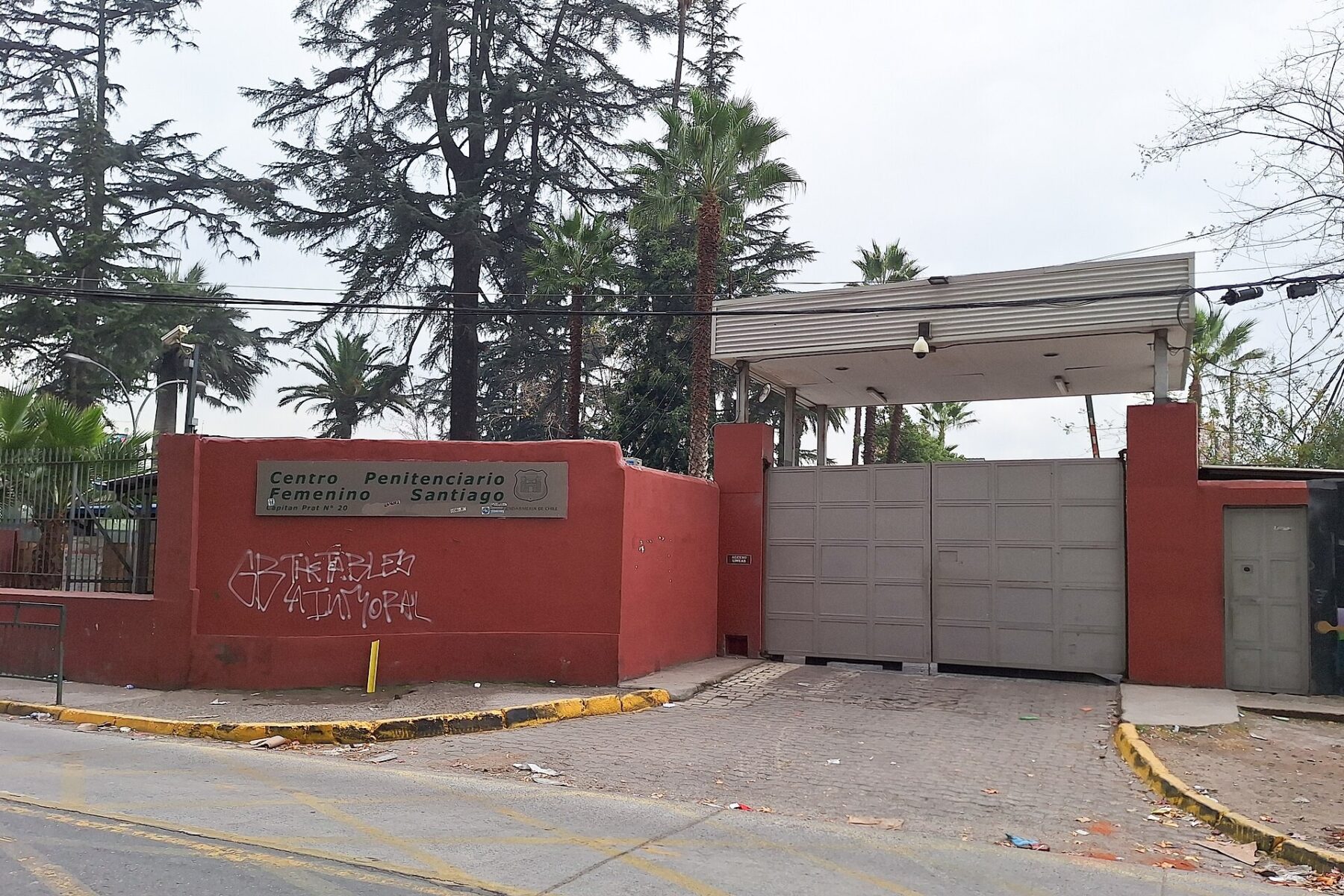 The gated entrance of the Centro Penitenciario Femenino de Santiago, a women's prison in San Joaquín, Santiago, Chile