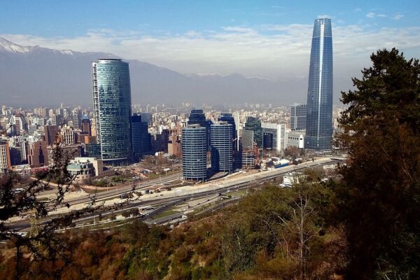 Glass office towers of Santiago's Sanhattan financial district, with the Gran Torre Santiago and the Andes in the distance