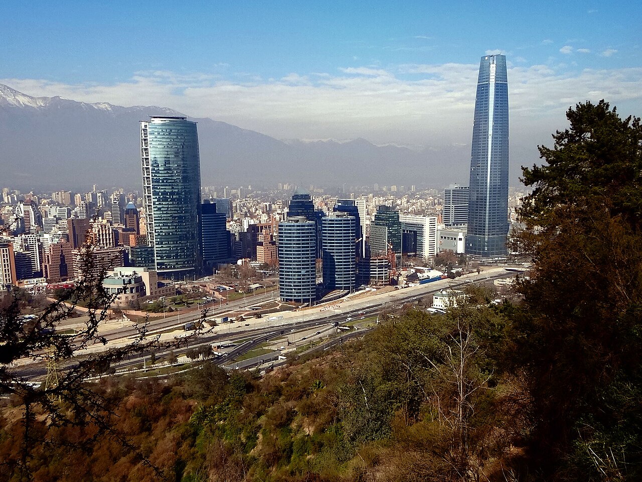 Glass office towers of Santiago's Sanhattan financial district, with the Gran Torre Santiago and the Andes in the distance