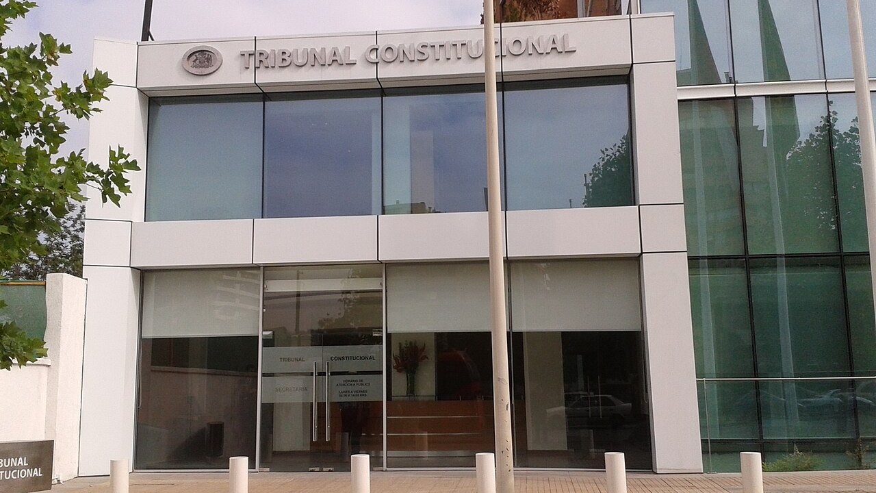 Glass entrance of the Constitutional Tribunal of Chile building in Las Condes, Santiago, with the court name on the facade