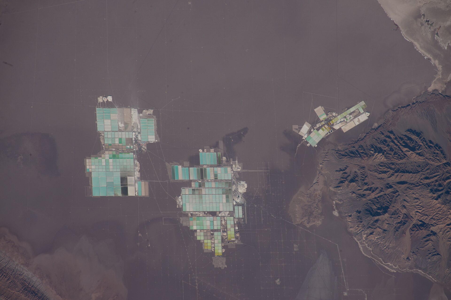 Space station view of lithium brine evaporation ponds on the Salar de Atacama in northern Chile