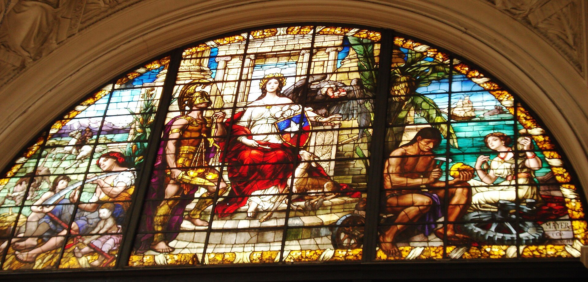 Stained-glass window inside the Palacio de los Tribunales de Justicia in Santiago showing a seated figure with the Chilean shield beside a soldier holding scales