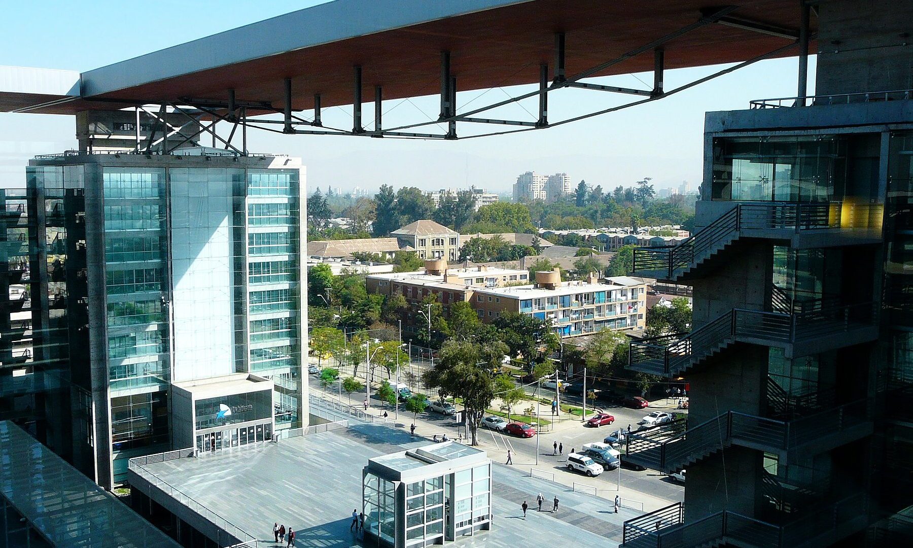 The plaza and glass towers of the Centro de Justicia de Santiago, the court complex in Chile's capital, under a clear sky