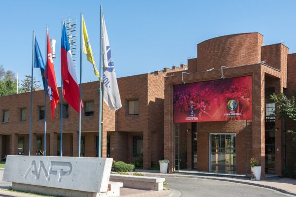 Brick headquarters of the ANFP, Chile's professional football association, in Santiago with its sign and flags in front