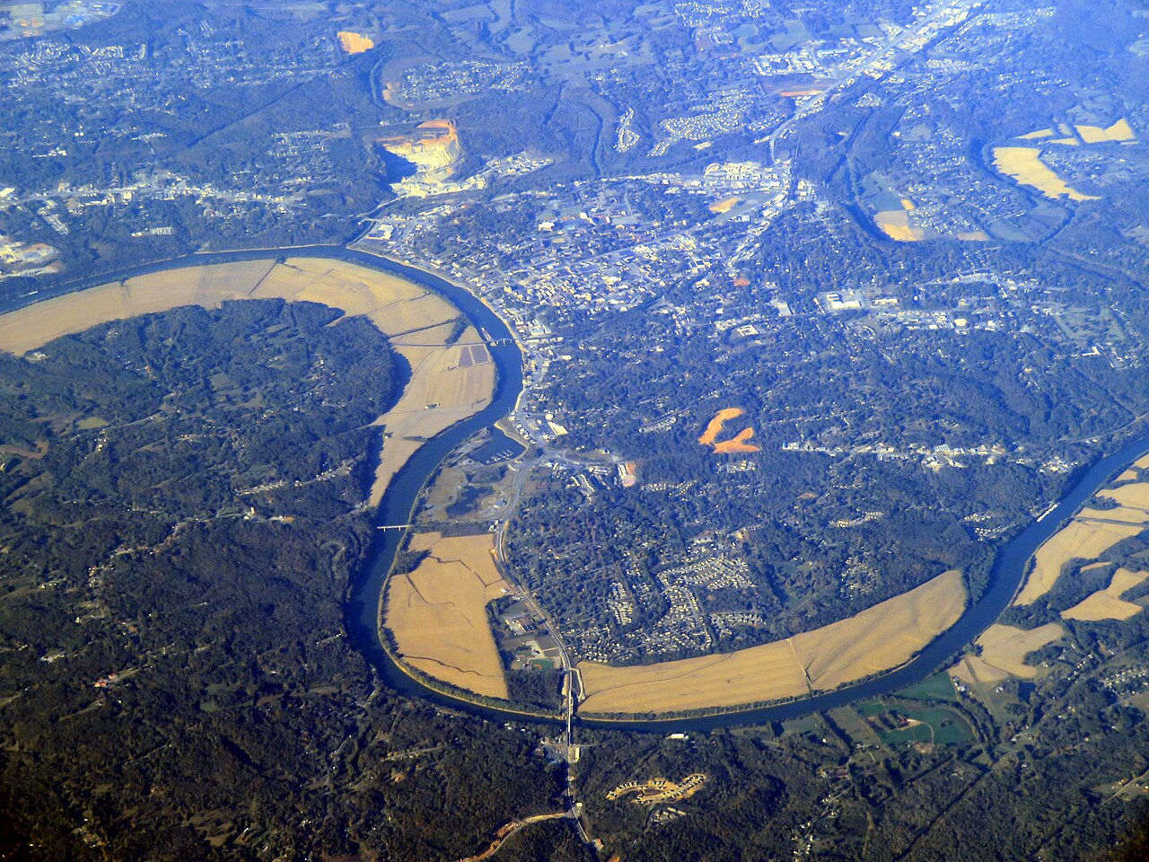 Aerial view of Clarksville, Tennessee, with the Cumberland River bending around the city and farm fields