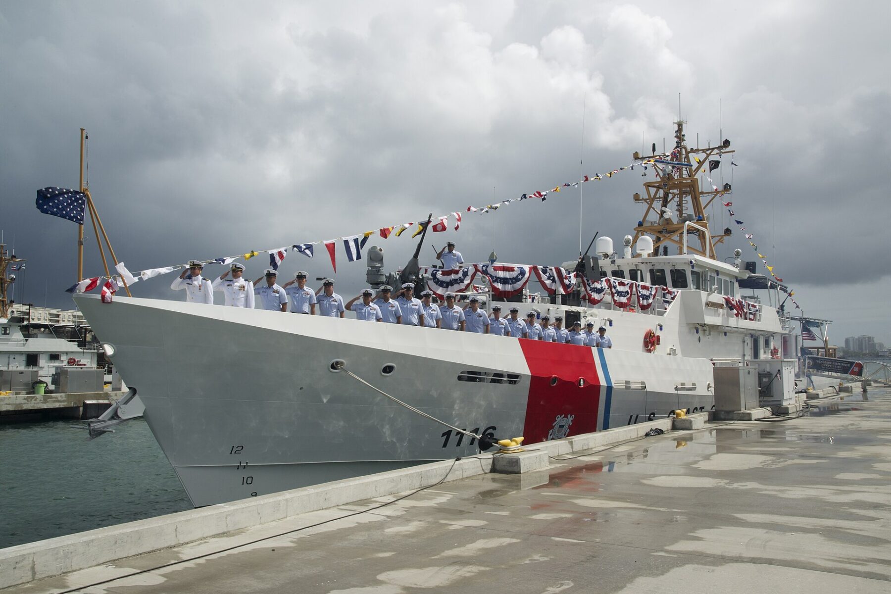 The US Coast Guard cutter Winslow Griesser moored at Sector San Juan, Puerto Rico, with its crew saluting at its 2016 commissioning