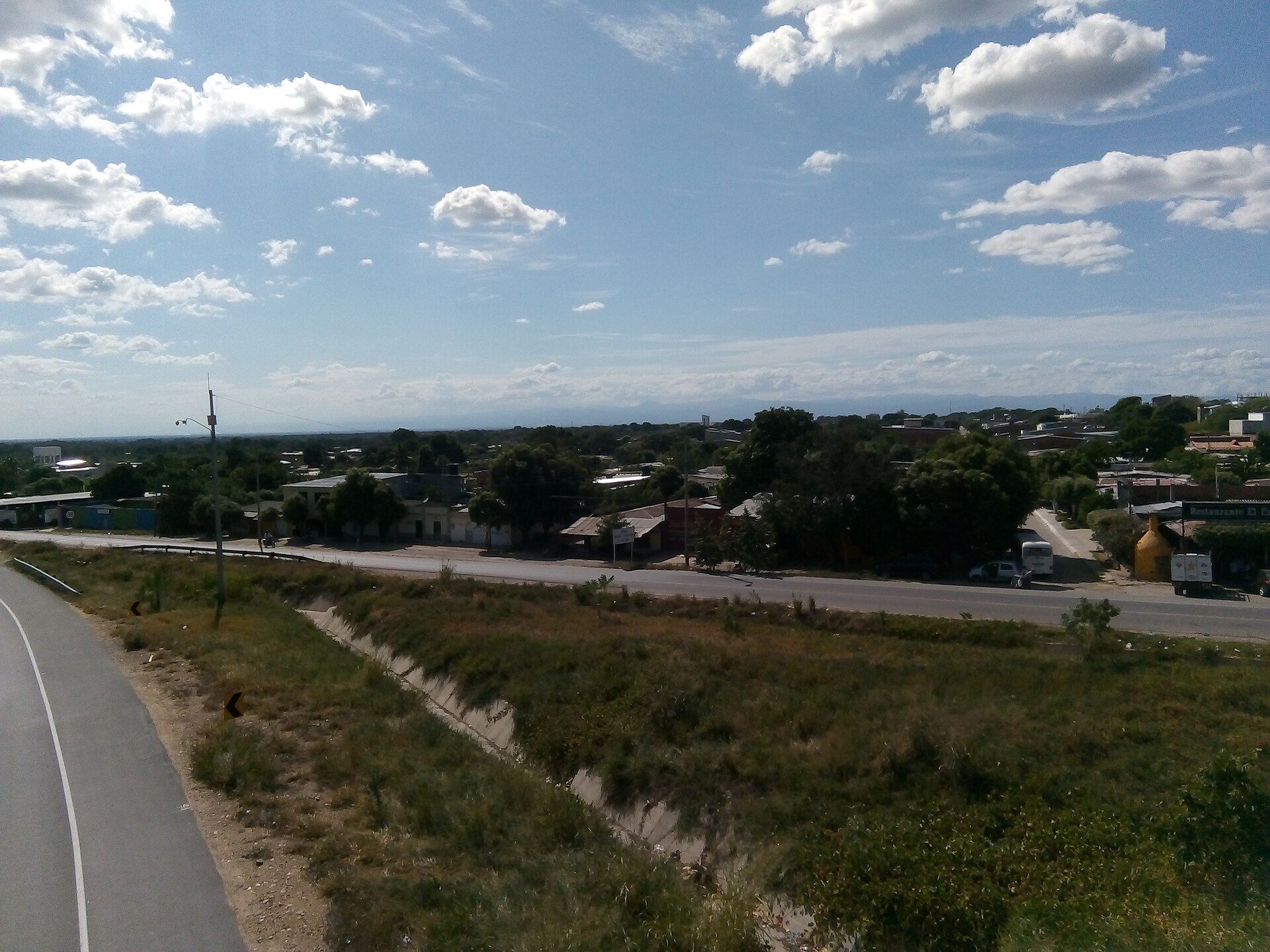 The bypass road and houses on the edge of Aguachica in Cesar, Colombia