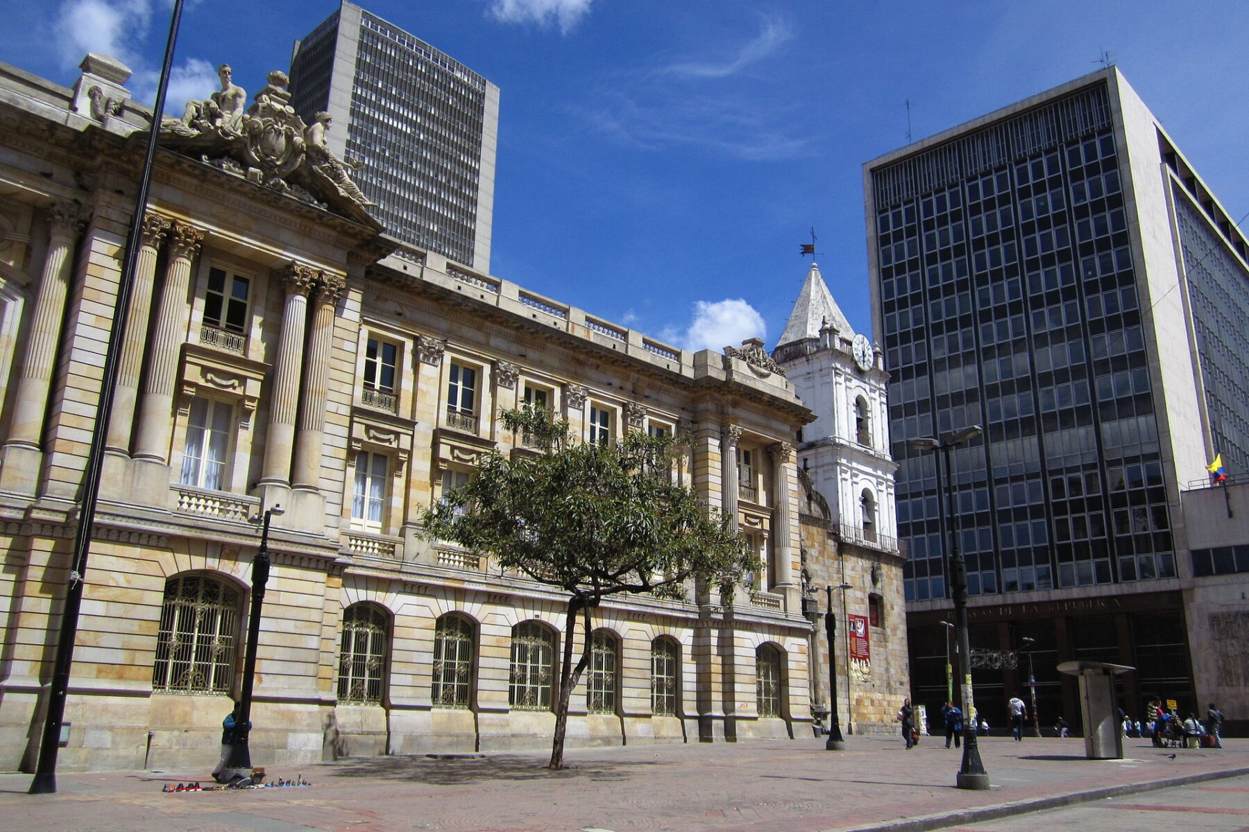 The modern Banco de la República headquarters on Avenida Jiménez in central Bogotá, Colombia, beside older stone buildings
