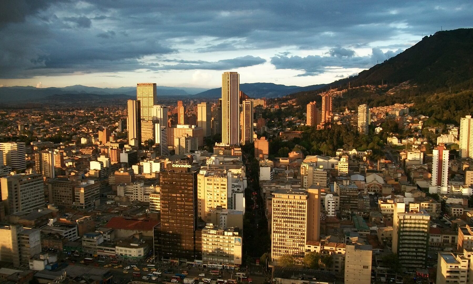 Downtown Bogotá at dusk with the towers of the Centro Internacional business district and the Eastern Hills behind