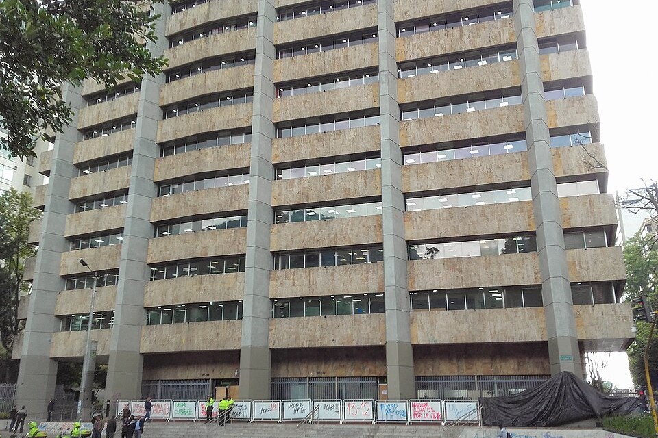 Ecopetrol office building on Carrera Séptima in Bogotá, Colombia, with pedestrians and police motorbikes in front