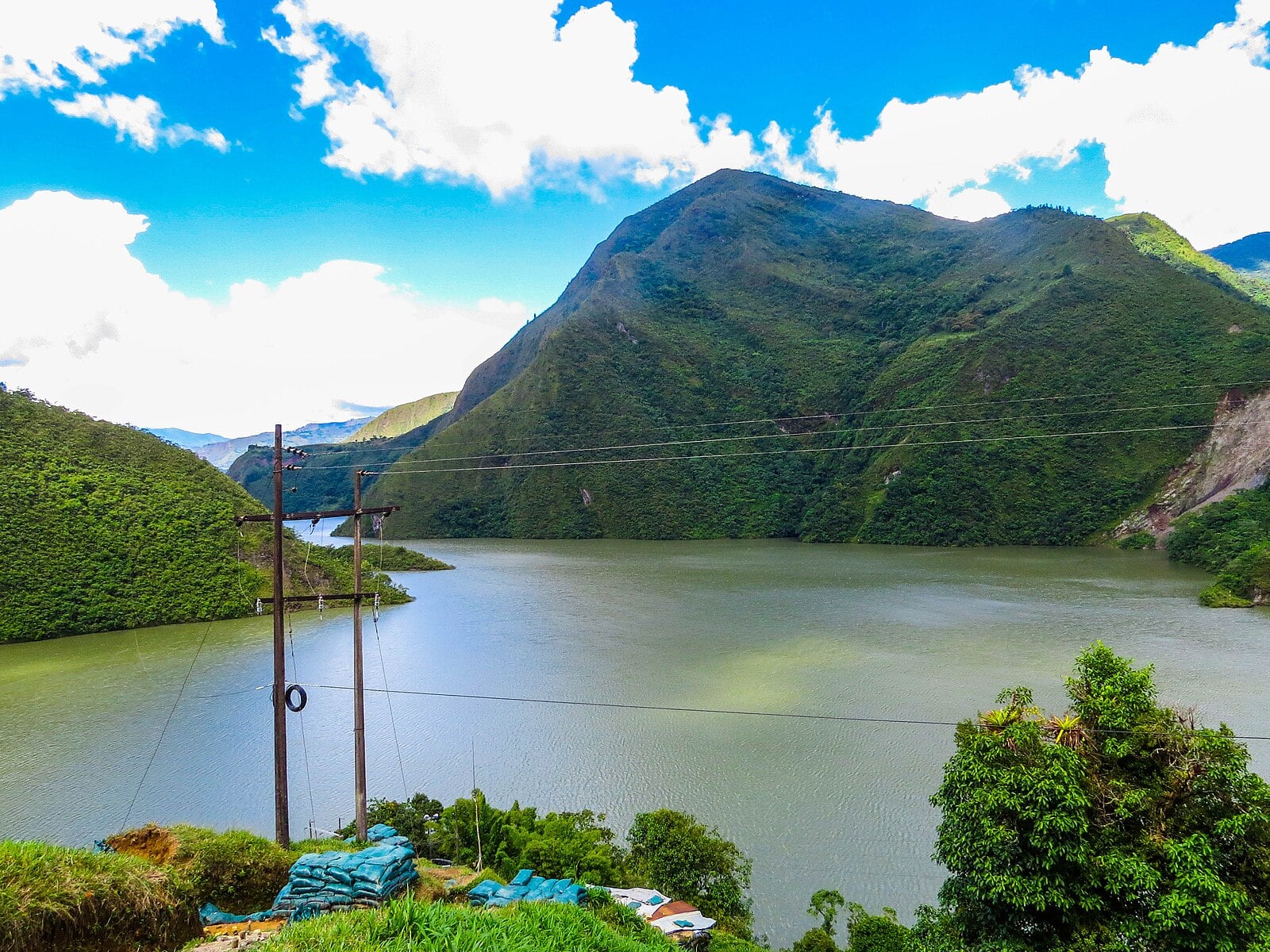 Power poles and cables beside the Chivor reservoir in Boyacá, Colombia
